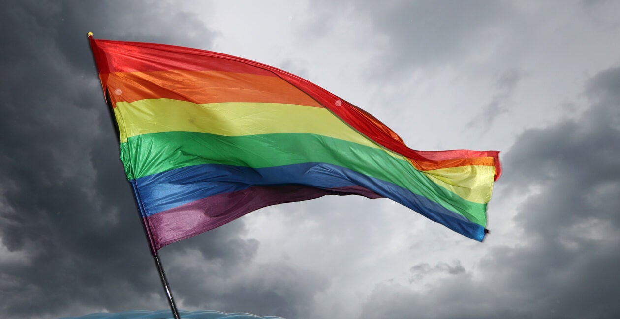 Todd Young Votes to Advance Radical Bill - LBGT Flag